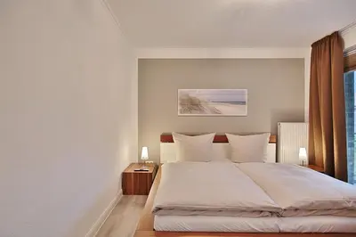 Ein Bett oder Betten in einem Zimmer der Unterkunft Domizil am Meer Domizil am Meer Appartement 14