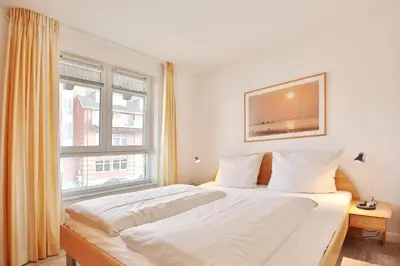 Ein Bett oder Betten in einem Zimmer der Unterkunft Feriendomizil Birkenallee Feriendomizil Birkenallee Appartement 05