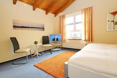 Ein Bett oder Betten in einem Zimmer der Unterkunft Feriendomizil Birkenallee Feriendomizil Birkenallee Appartement 13