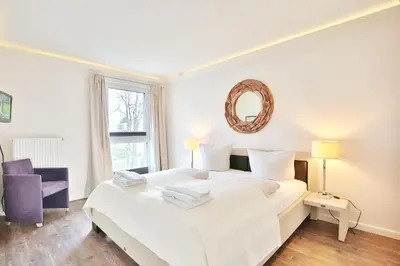 Ein Bett oder Betten in einem Zimmer der Unterkunft Domizil am Meer Domizil am Meer Appartement 16