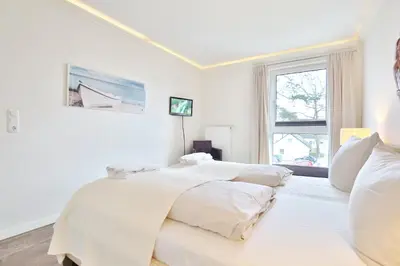 Ein Bett oder Betten in einem Zimmer der Unterkunft Domizil am Meer Domizil am Meer Appartement 16