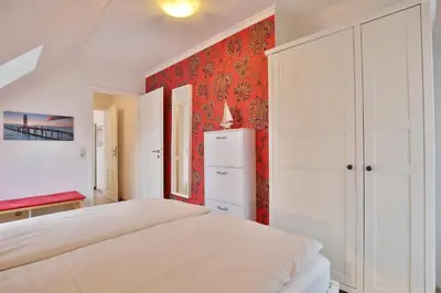 Ein Bett oder Betten in einem Zimmer der Unterkunft Timmendorfer Strand Haus Parkblick Appartement 10