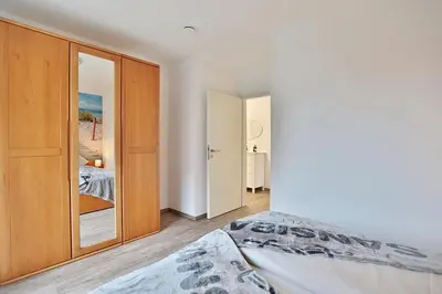 Ein Bett oder Betten in einem Zimmer der Unterkunft Wohnpark am Mühlenteich Wohnpark am Mühlenteich Appartement 32