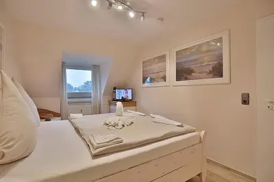 Ein Bett oder Betten in einem Zimmer der Unterkunft Domizil Strandburg Domizil Strandburg Appartement 26 Sonneneck