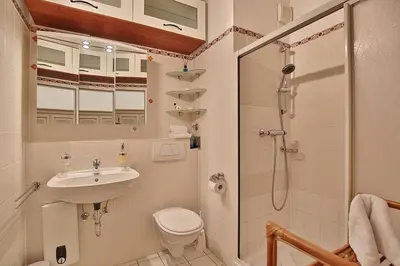 Ein Badezimmer in der Unterkunft Maison Baltique Tdf Strand Maison Baltique Appartement 5