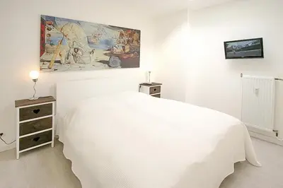 Ein Bett oder Betten in einem Zimmer der Unterkunft Haus Miramar Treffert Appartement 38