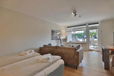 Ein Bett oder Betten in einem Zimmer der Unterkunft Villa Idyll Strandstudio Appartement 12 in der Villa Idyll