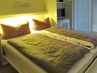 Ein Bett oder Betten in einem Zimmer der Unterkunft Ferienanlage Bergstraße 62 Appartement Strandzwerg Appartement 10