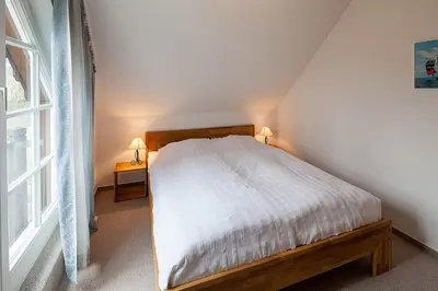 Ein Bett oder Betten in einem Zimmer der Unterkunft Am Rosenhain 7 Am Rosenhain 7 Appartement 6