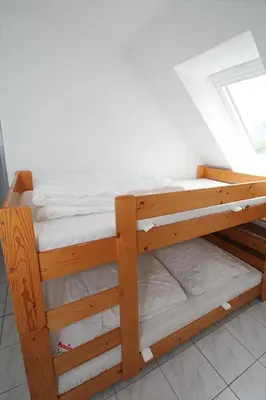 Ein Bett oder Betten in einem Zimmer der Unterkunft Am Rosenhain 7 Am Rosenhain 7 Appartement 6