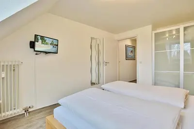 Ein Bett oder Betten in einem Zimmer der Unterkunft Ferienanlage Bergstraße 62 Ferienhaus Bergstraße 62 Appartement 17