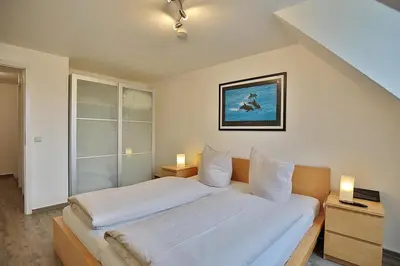 Ein Bett oder Betten in einem Zimmer der Unterkunft Ferienanlage Bergstraße 62 Ferienhaus Bergstraße 62 Appartement 17