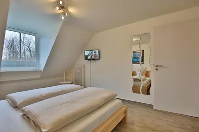 Ein Bett oder Betten in einem Zimmer der Unterkunft Ferienanlage Bergstraße 62 Ferienhaus Bergstraße 62 Appartement 17