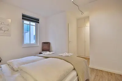 Ein Bett oder Betten in einem Zimmer der Unterkunft Residenz Poststraße 12 Residenz Poststraße 12 Appartement 1