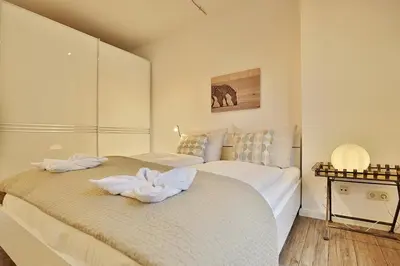 Ein Bett oder Betten in einem Zimmer der Unterkunft Residenz Poststraße 12 Residenz Poststraße 12 Appartement 1