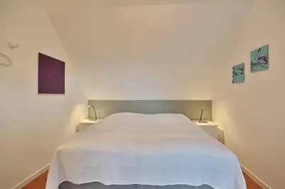Ein Bett oder Betten in einem Zimmer der Unterkunft Am Rosenhain 19 Am Rosenhain 19 Appartement 4