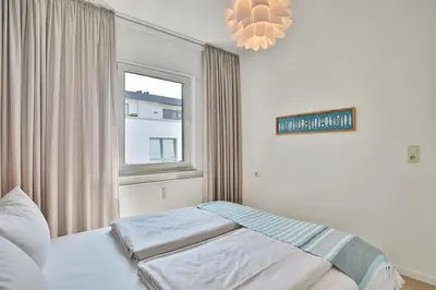 Ein Bett oder Betten in einem Zimmer der Unterkunft Haus Strandallee 188 Schmuckkästchen