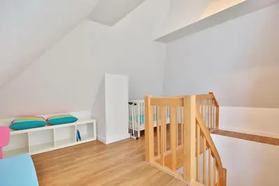 Ein Bett oder Betten in einem Zimmer der Unterkunft Maison Baltique Niendorf Ferienwohnung 
