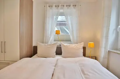 Ein Bett oder Betten in einem Zimmer der Unterkunft Parkresidenz Bergstraße 52 Parkresidenz Bergstraße 52 Appartement 2