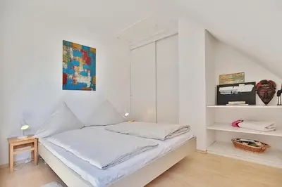 Ein Bett oder Betten in einem Zimmer der Unterkunft Haus Kastanienallee 3 Haus Kastanienallee 3 Appartement 8