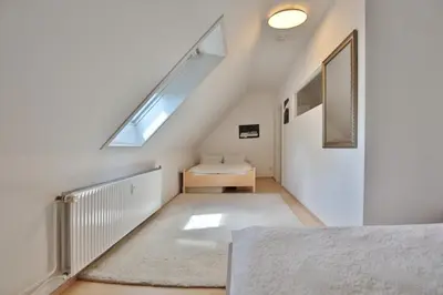 Ein Bett oder Betten in einem Zimmer der Unterkunft Haus Kastanienallee 3 Haus Kastanienallee 3 Appartement 8