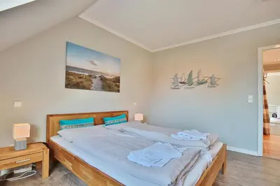 Ein Bett oder Betten in einem Zimmer der Unterkunft Wohnpark am Mühlenteich Wohnpark am Mühlenteich Appartement 46