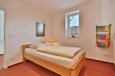 Ein Bett oder Betten in einem Zimmer der Unterkunft Ferienhaus Gorch-Fock-Str 37 Ferienhaus Gorch-Fock-Str 37