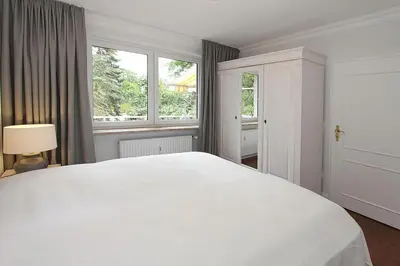 Ein Bett oder Betten in einem Zimmer der Unterkunft Die Insel Die Insel Appartement 210
