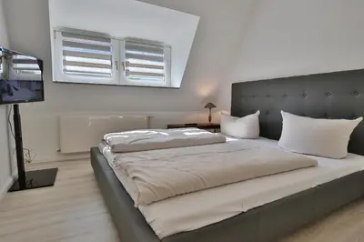 Ein Bett oder Betten in einem Zimmer der Unterkunft Haus Strandidyll Haus Strandidyll Haus 2