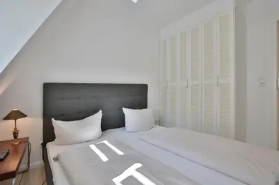 Ein Bett oder Betten in einem Zimmer der Unterkunft Haus Strandidyll Haus Strandidyll Haus 2