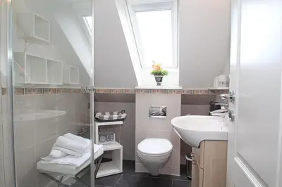 Ein Badezimmer in der Unterkunft Fh Dornkampstraße 1 a Ferienhaus Dornkampstrasse 1a Appartement 8