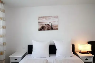 Ein Bett oder Betten in einem Zimmer der Unterkunft Residenz am Timmendorfer Platz Residenz am Timmendorfer Platz Appartement 1