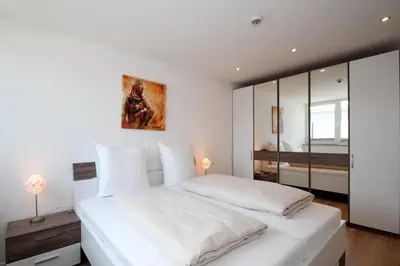 Ein Bett oder Betten in einem Zimmer der Unterkunft Residenz am Timmendorfer Platz Residenz am Timmendorfer Platz Appartement 2