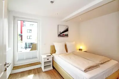 Ein Bett oder Betten in einem Zimmer der Unterkunft Residenz am Timmendorfer Platz Residenz am Timmendorfer Platz Appartement 3