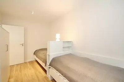 Ein Bett oder Betten in einem Zimmer der Unterkunft Villa Stern Villa Stern Appartement 03