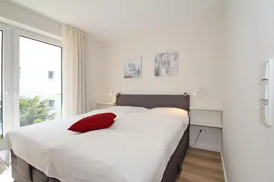 Ein Bett oder Betten in einem Zimmer der Unterkunft Villa Stern Villa Stern Appartement 07
