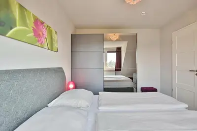 Ein Bett oder Betten in einem Zimmer der Unterkunft Die Wolburg Die Wolburg Appartement 10