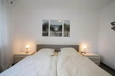 Ein Bett oder Betten in einem Zimmer der Unterkunft Haus Strandstrasse Strandstrasse 150 Appartement 3