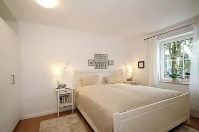 Ein Bett oder Betten in einem Zimmer der Unterkunft Modernes Strandhus Modernes Strandhus Appartement 109