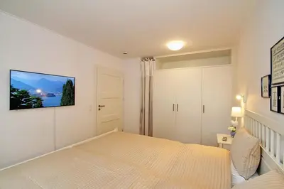 Ein Bett oder Betten in einem Zimmer der Unterkunft Modernes Strandhus Modernes Strandhus Appartement 109