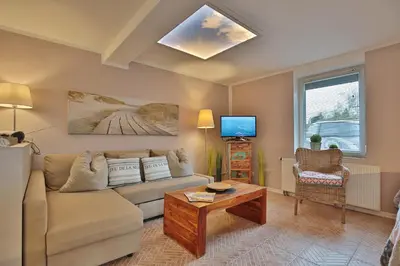 Ein Sitzbereich in der Unterkunft Ferienbungalow Erlenweg 20 Erlenweg 20 Appartement 3 Niendorf Ostsee