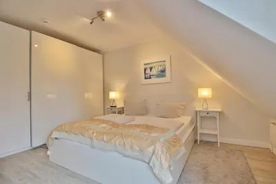 Ein Bett oder Betten in einem Zimmer der Unterkunft Wohnpark am Mühlenteich Wohnpark am Mühlenteich Appartement 34
