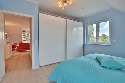 Ein Bett oder Betten in einem Zimmer der Unterkunft Haus Bergstrasse 4 Haus Bergstraße 4 Appartement 9