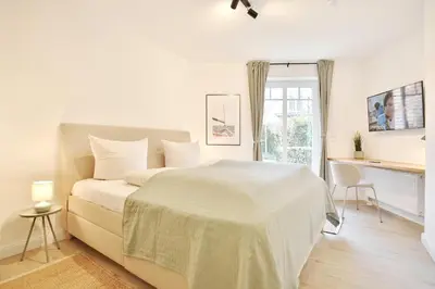 Ein Bett oder Betten in einem Zimmer der Unterkunft Villa am Meer Strandallee 48, App 04