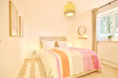 Ein Bett oder Betten in einem Zimmer der Unterkunft Villa am Meer Strandallee 48, App 04