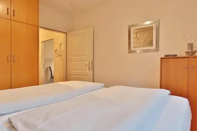 Ein Bett oder Betten in einem Zimmer der Unterkunft Am Rosenhain 23 Am Rosenhain 23 Appartement 01