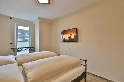 Ein Bett oder Betten in einem Zimmer der Unterkunft Logenplatz am Kammerweg Ostseetraum Appartement 7
