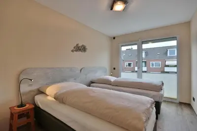 Ein Bett oder Betten in einem Zimmer der Unterkunft Logenplatz am Kammerweg Ostseetraum Appartement 7