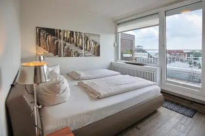 Ein Bett oder Betten in einem Zimmer der Unterkunft Ferienanlage Hansastrasse 3 Seaside Appartement 14
