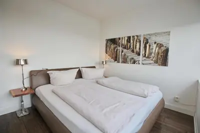 Ein Bett oder Betten in einem Zimmer der Unterkunft Ferienanlage Hansastrasse 3 Seaside Appartement 14